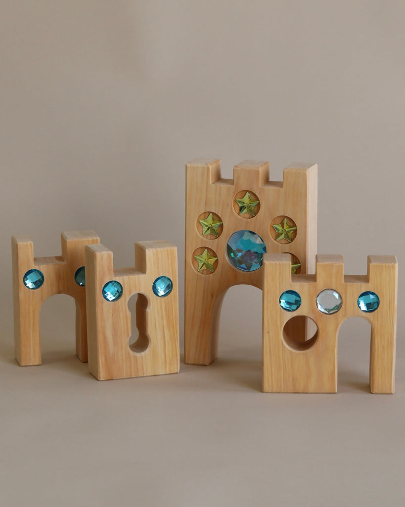 Wooden castle toy with gem inserts