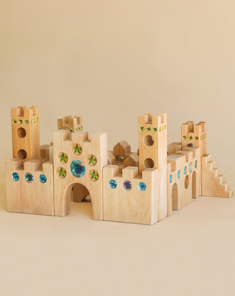 Wooden castle toy with gem inserts