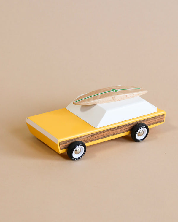 wooden car toy with surfboard