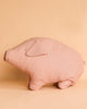 A soft fabric pig plush toy is set against a plain beige background. The Maileg Polly Pork, Large is simple in design with minimal details, featuring basic stitched eyes and a small fabric ear, capturing a cute and minimalist aesthetic that invites a warm hug.