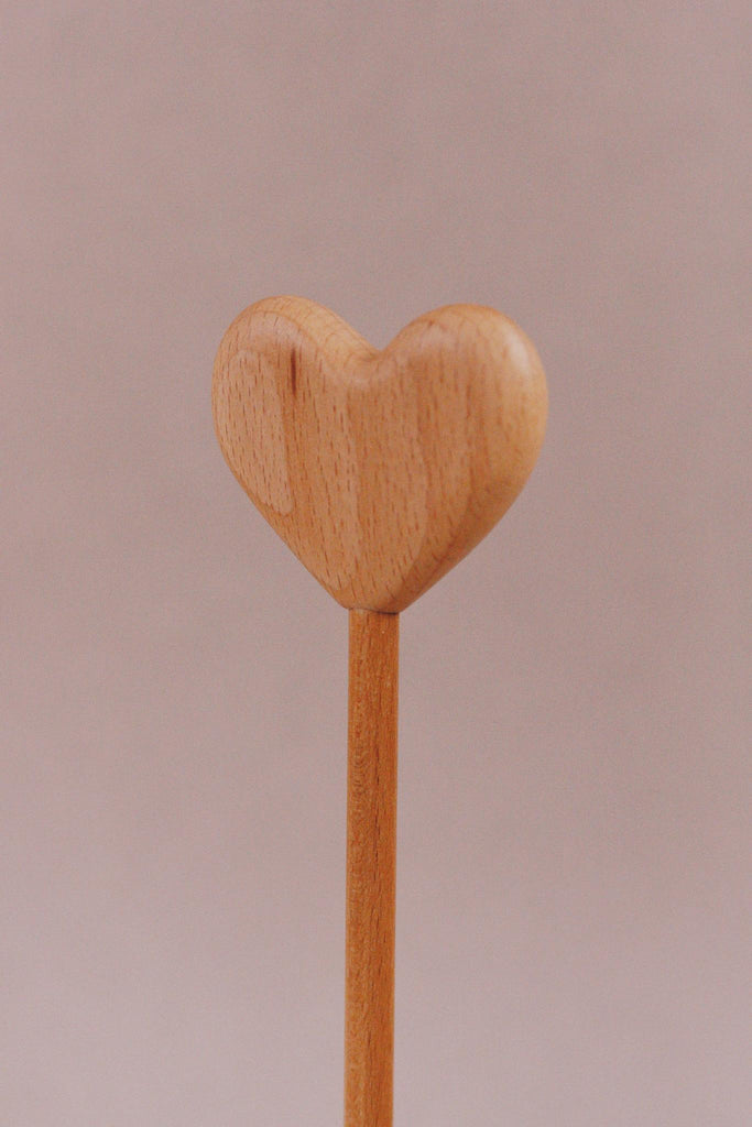 Introducing the Handmade Wooden Heart Magic Wand, featuring a beautifully carved heart from cherry wood, exquisitely polished atop a sleek stick.