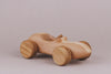 Introducing the Handmade Wooden Race Car: crafted from beech wood, featuring ultra-smooth wheels and a natural linseed oil finish.