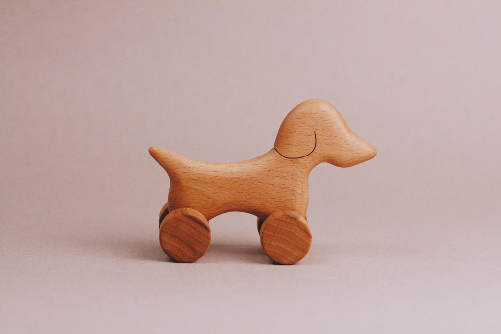 A Handmade Wooden Mini Dog Push Toy.