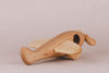 The Handmade Wooden Airplane, crafted with smooth curves and a minimalist design, is finished with natural linseed oil. Set against a neutral background, it features a propeller and two wings, emphasizing its simple yet elegant appearance.