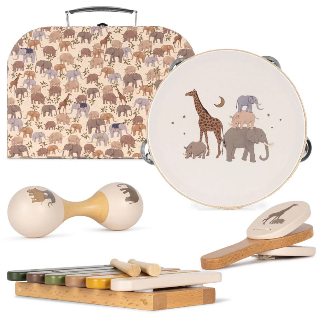 Introducing the Konges Sløjd - Music Set - Safari, a delightful collection of wooden instruments perfect for children. This set includes a tambourine, maracas, castanets, and a xylophone, each adorned with whimsical animal designs featuring elephants and giraffes. The instruments are beautifully displayed in front of an enchanting suitcase that shares the same playful safari patterns.