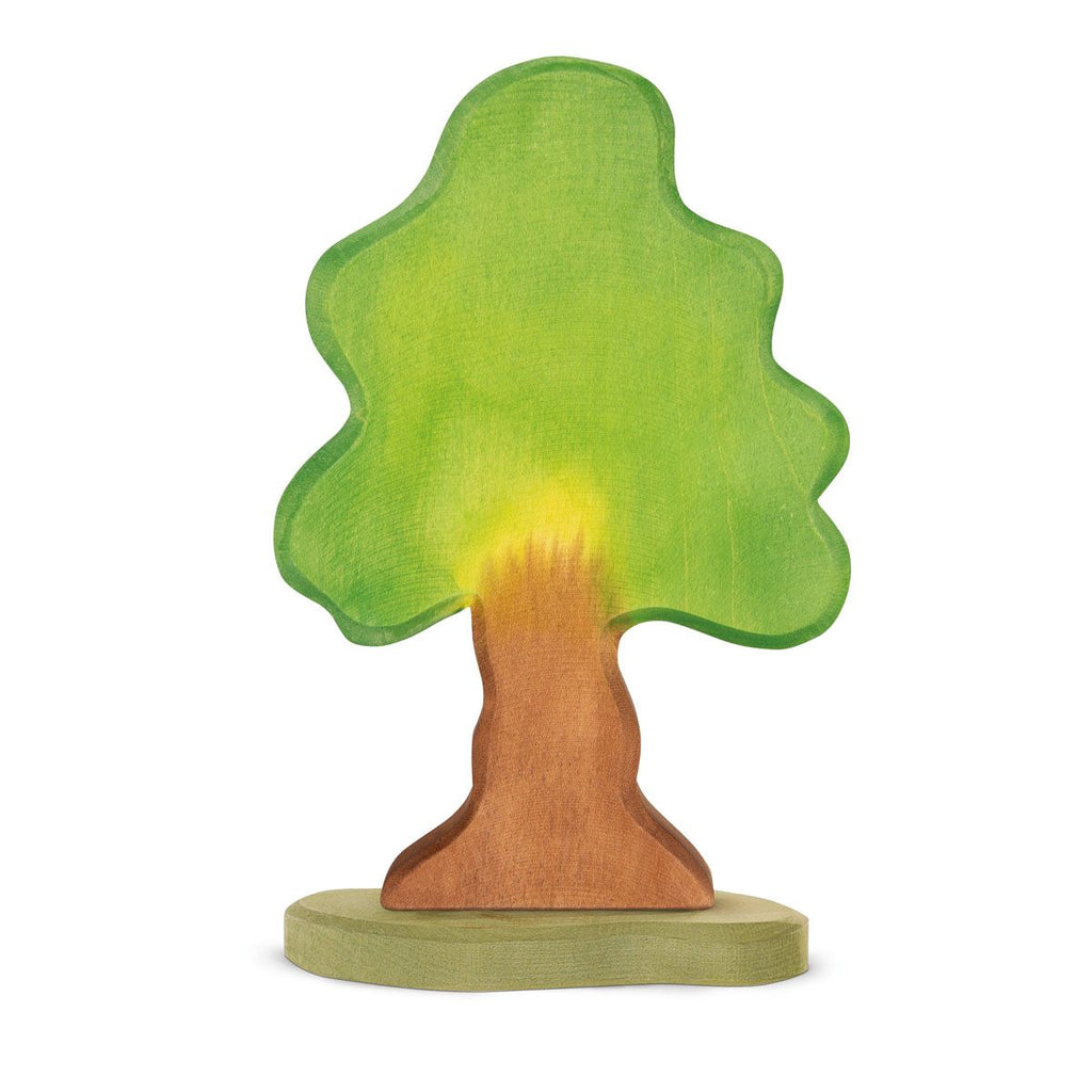 The Ostheimer Oak Tree is a handcrafted wooden toy featuring a broad green canopy and a brown trunk, standing on an oval base. This tree has a simplified design with smooth edges and a natural finish, meticulously crafted from sustainably sourced materials.