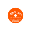 An orange circular logo with white text that reads "spiel gut" is prominently displayed on the Teddy Hermann Standing Tabby Cat Stuffed Animal. Below the logo, additional text states "vom arbeitsausschuss kinderspiel + spielzeug ausgezeichnet recommended." The black background accentuates its child-friendly design.