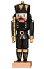 A distinguished wooden nutcracker figurine, the Christian Ulbricht Collectible Wooden Nutcracker - King In Black, echoes the traditional German craftsmanship. Dressed as a soldier in striking black and gold attire, it boasts a black hat with gold detailing. The piece features blue eyes and a red mouth while holding a golden scepter, all standing gracefully on a square wooden base.