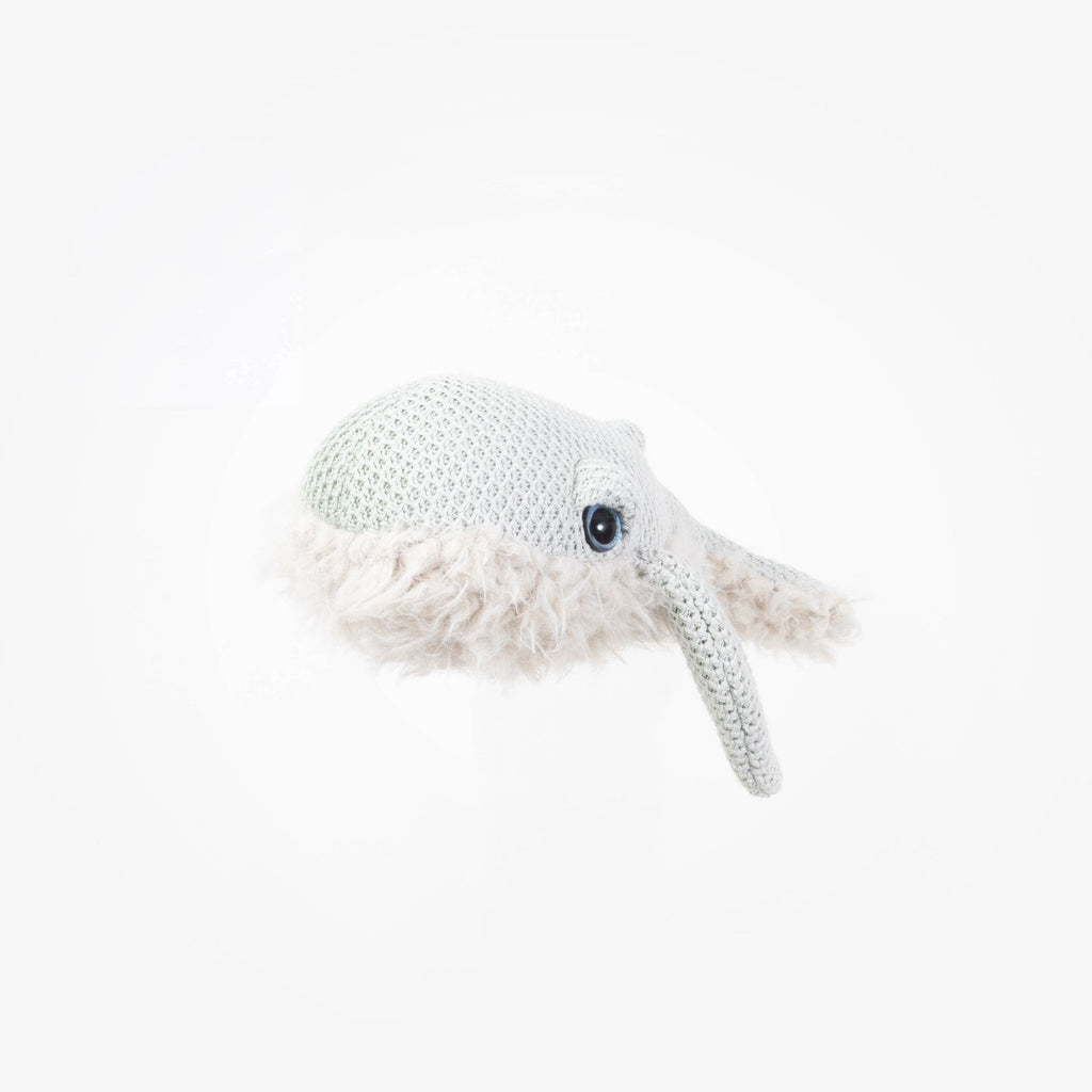 A handcrafted BigStuffed Mini Grandma Whale comforter with a long, pointed snout and fluffy underbelly. The mini whale has a textured body with a visible eye on the side. Made in Lithuania, it sits against a plain white background, highlighting the detailed craftsmanship of this plush toy.