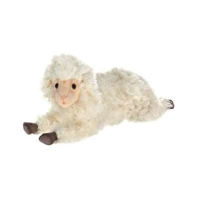 A Little Lamb Stuffed Animal, with curly white fur and light brown hooves, is lying on the ground in a relaxed position. This hand sewn animal has a soft, friendly appearance and seems to be made for children to cuddle.