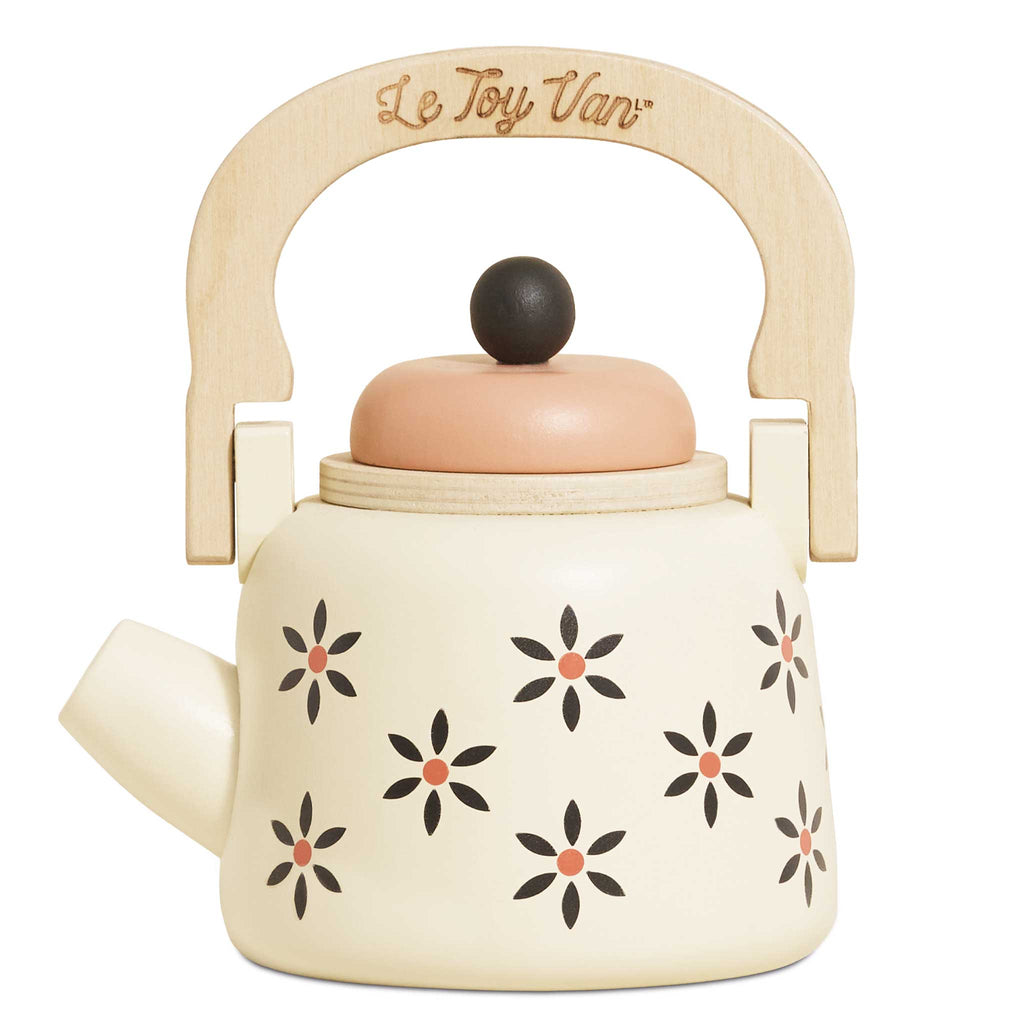 The Vintage Wooden Role Play Kettle is cream-colored and crafted from FSC certified wood, adorned with black and pink floral designs. It includes a wooden handle, a round lid with a black knob, and has the words "Le Toy Van" engraved on the handle.