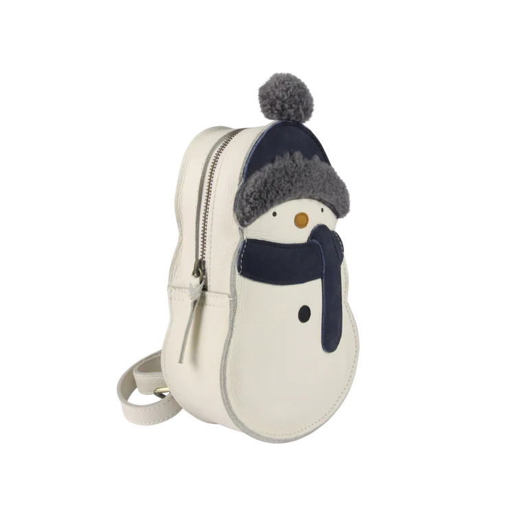 A small, round white Donsje Kliff Backpack designed to look like a snowman wearing a dark blue hat with a pom-pom. The backpack features a zipper and an adjustable strap, perfect as a Christmas accessory.