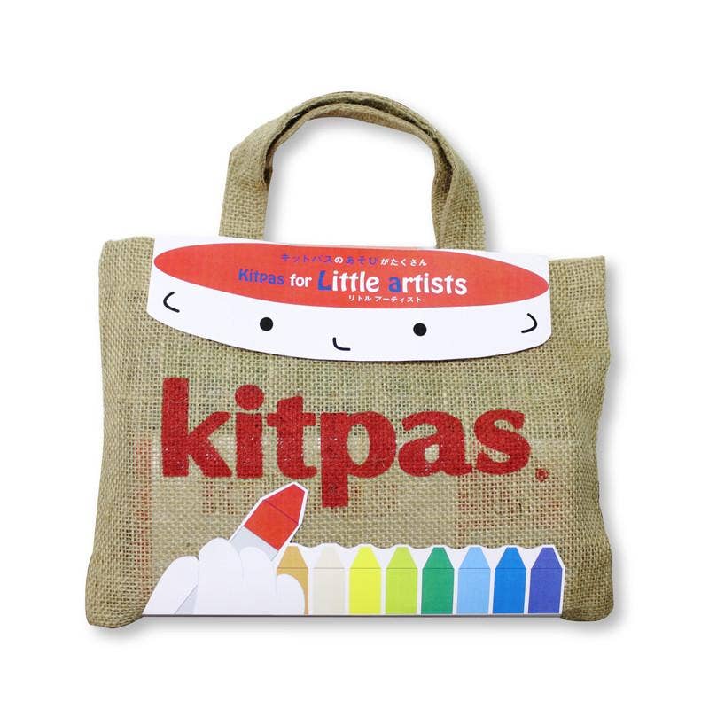 Introducing the Kitpas Creative Crayon Bag for Little Artists: a handcrafted jute bag with a handle, adorned with a cartoon face and vibrant crayon illustrations at the bottom, perfect for inspiring creative painting adventures.