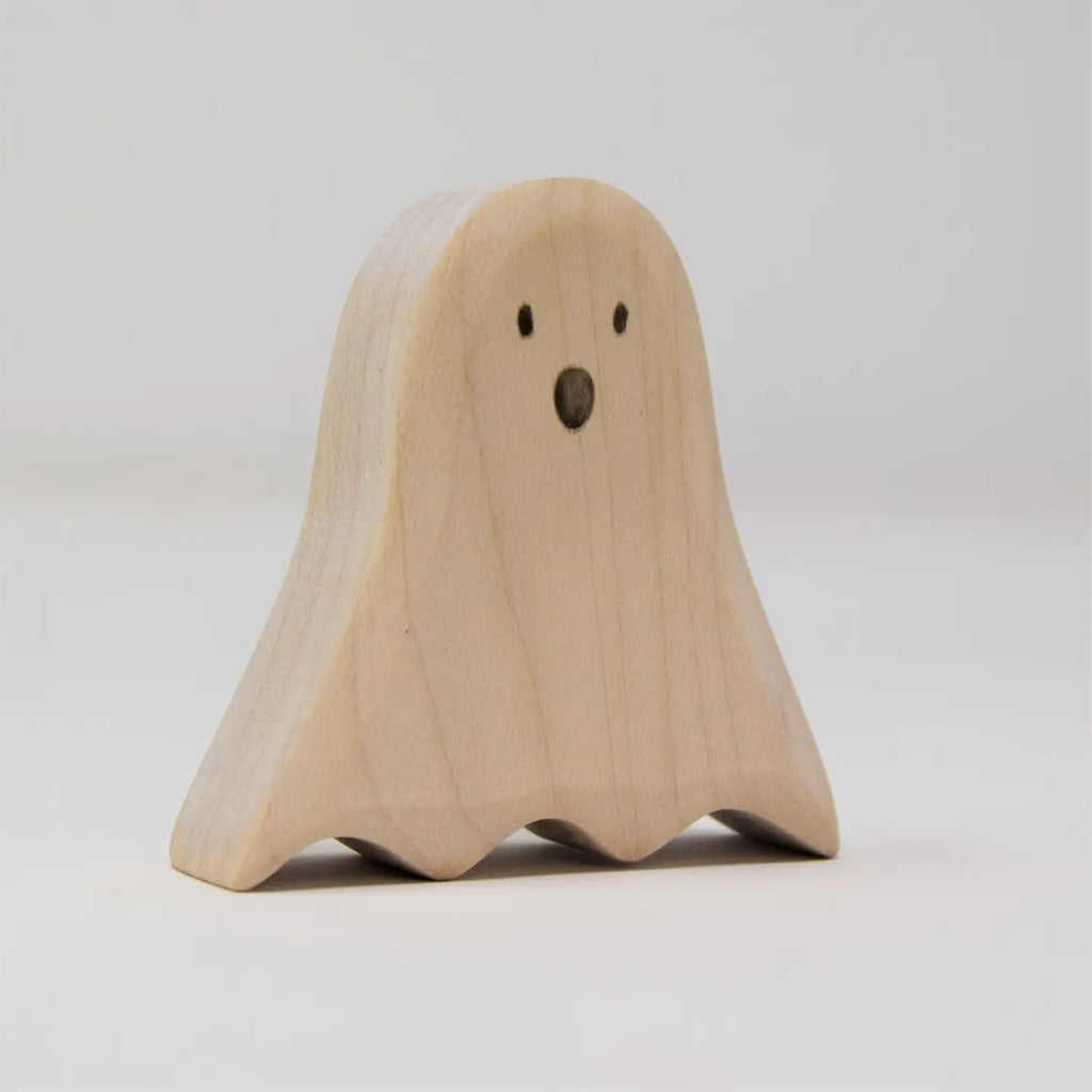 Two Wooden Standing Ghosts, crafted from sustainable hardwood, are showcased against a plain background. The ghost on the left stands upright with a surprised expression, while the ghost on the right leans to one side, smiling playfully with its curved body.