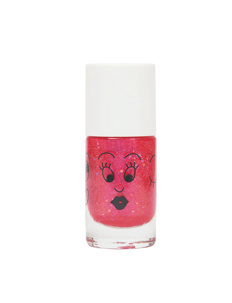 A bottle of Nailmatic - Nail Polish - Sissi with a cartoon face featuring eyes, eyelashes, and lips printed on the front, against a white background.