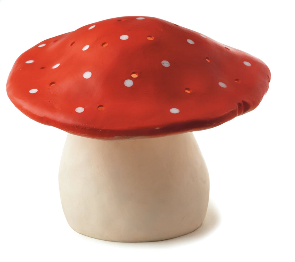 A Large Red Mushroom Lamp isolated on a white background. The cap of the mushroom is brightly colored with white spots, and the stalk is plain white.