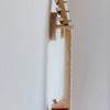 A side view of a stringed musical instrument, such as a Loog Mini or Loog Pro, elegantly suspended on the white wall using the Guitar Wall Hanger For Loog Mini. The focus is on its neck and tuning pegs to highlight its sleek and minimalistic design.