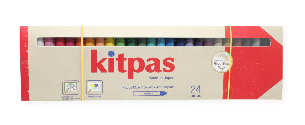 This box of Kitpas Crayons - 24 Colors, made in Japan with eco-friendly rice bran wax, features a chic red and beige package design complemented by a transparent window to display its vibrant colors, emphasizing its dedication to sustainable art products.