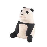 The Handmade Tiny Wooden Panda is a small, minimalist figurine crafted from light-colored Albizia wood. This handcrafted piece depicts an upright panda with black accents on its ears, eyes, arms, and legs, featuring a simple, smooth, and stylized design.