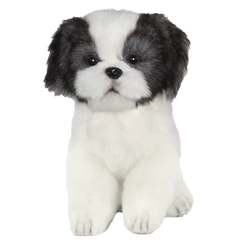 Introducing the Shih Tzu Tea Cup Dog Stuffed Animal: a realistic plush toy dog featuring fluffy white fur with adorable black patches on its ears and around its eyes. This meticulously hand-sewn toy has a round face, black nose, and dark eyes, sitting upright in an endearing and lifelike manner.