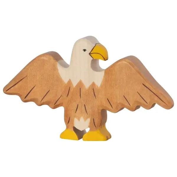 A wooden toy in the shape of a Holztiger Eagle with outstretched wings. The eagle is painted with a brown and cream color scheme, featuring a yellow beak and yellow feet. This individually handcrafted piece resembles HOLZTIGER figures, made from maple and beech wood for a simple, artisanal appearance.