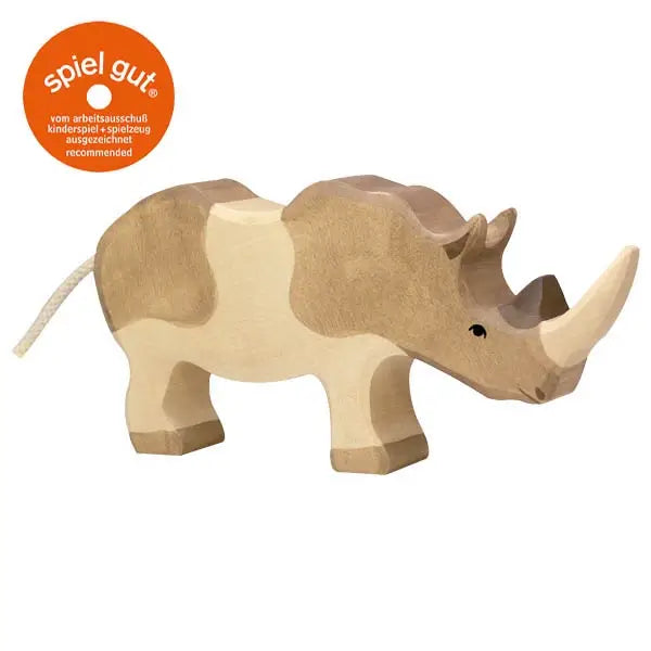 A handcrafted Holztiger Rhinoceros with a natural finish and simple, stylized features. Boasting a "Spiel Gut" recommendation sticker in the top left corner, this figure highlights its high-quality craftsmanship and superior play value characteristic of HOLZTIGER figures.