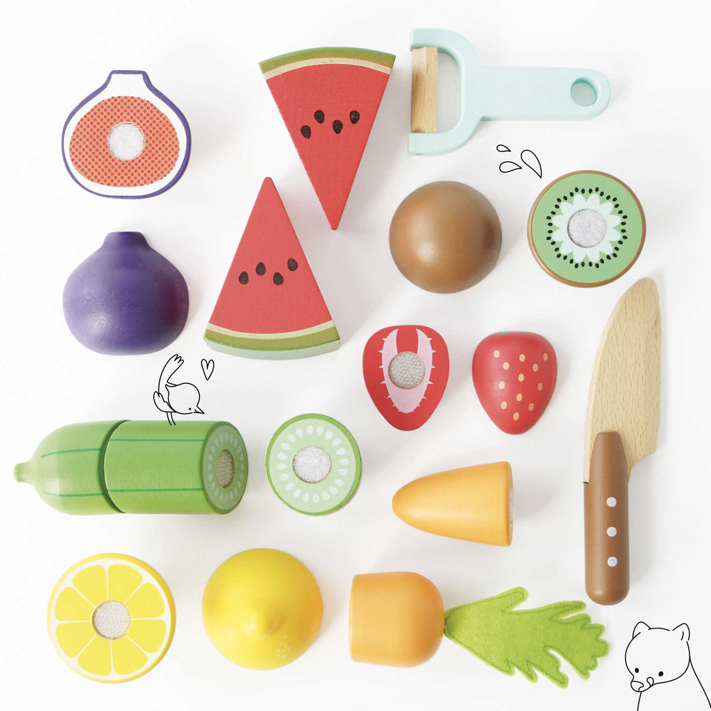 The Wooden Chopping Board & Sliceable Play Food set features wooden toy fruits and vegetables, such as watermelon slices and carrots, arranged on a flat surface. Illustrated rabbits and a bear playfully join in the scene, enhancing fine motor skills through imaginative role play.