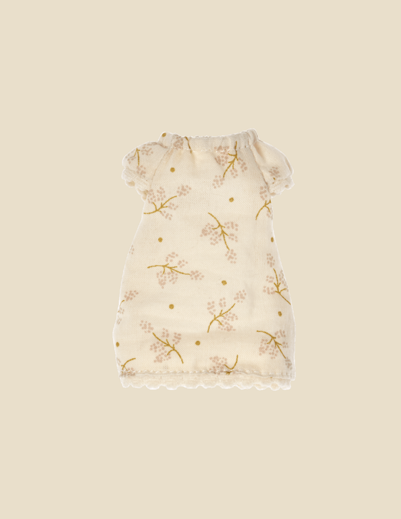 Maileg Extra Clothing: Nightgown For Big Sister Mouse is cream-colored with delicate floral patterns in light brown and yellow, perfect for a pyjamas party. The nightgown features short sleeves, a gathered neckline, and scalloped hems at the bottom. The background is a soft beige tone.