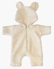 This snug Winnie Jumpsuit in Ecru Bouclette is a delightful piece of Minikane doll clothing, characterized by a charming hood with bear ears. It features an easy-use front zipper and is made from soft, textured material, ideal for little adventurers or anyone looking for cuddly comfort.