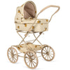 Introducing the Doll Pram - Grand Lemon: a vintage-style baby stroller designed with a charming beige and brown leaf pattern. It features four large, spoked wheels and a sleek handlebar, along with an enclosed bassinet elegantly topped with a quilted hood. This timeless piece is lovingly crafted from recycled materials.