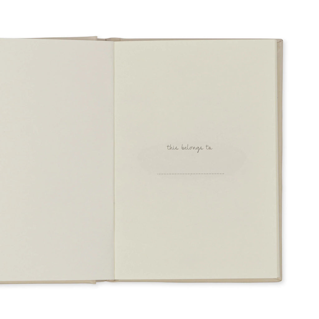 An open book showing its inside front cover. The page on the left is blank, while the page on the right has the text "this belongs to" followed by a blank line for the owner's name. Perfect for tiny bakers, this Madeline Baking Set - Petite Cousine's pages are of a plain off-white color, ready to inspire culinary adventures.