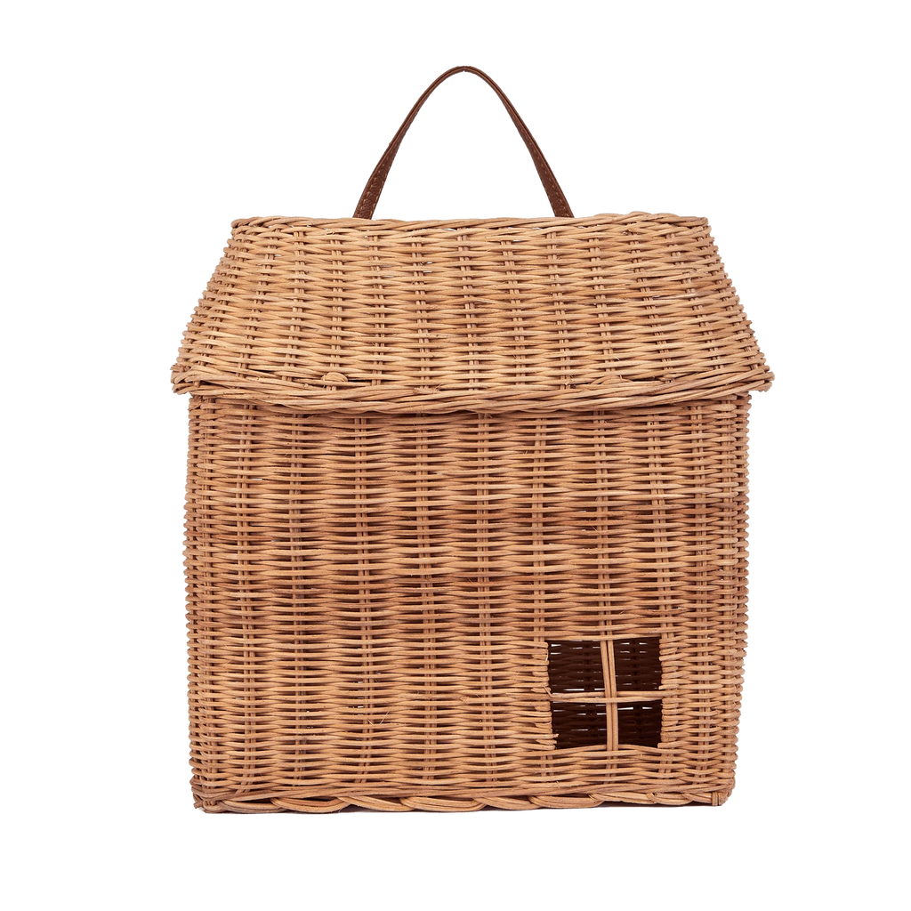 The Olli Ella Hanging Rattan Basket Hutch is a woven wicker basket designed to resemble a small house, complete with a pitched roof and a handle at the top. This handcrafted rattan storage solution features a charming square window detail on the front.