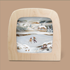 Product Name: Silhouette Only - Rosy Cheeks Silhouette for Toverlux Lamp (ships in approximately one week)

Description: An enchanting Rosy Cheeks Silhouette of a winter scene, framed in wood and crafted by Robin Pieterse. It features two magical silhouettes of people ice skating gracefully on a frozen pond, surrounded by snowy hills and quaint houses. A sled and pair of skates rest nearby, enhancing the idyllic landscape perfect for your Toverlux Lamp.