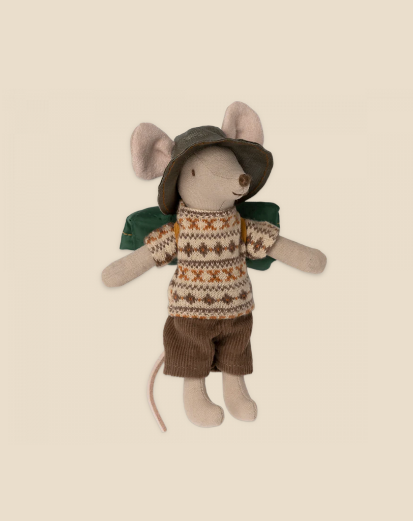 A charming Maileg Hiker Mouse, Big Brother doll, wearing a beige fair isle sweater, brown shorts, and a cute gray hat, sits against a soft beige background.