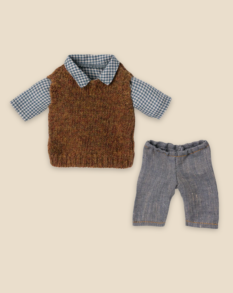 A neatly arranged outfit for a child, featuring a checkered blue and white shirt with a brown knitted vest over it, paired with gray pants. Each piece can be purchased separately. The clothes are displayed on a plain beige background, evoking the timeless style of Maileg Extra Clothing: Shirt, Slipover and Pants for Teddy Dad.