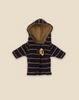 The Maileg Extra Clothing: Duffle Coat for Teddy Junior is a small navy blue and beige striped hoodie with a front toggle closure, perfect for enhancing your Teddy Junior's outfit. The hoodie features long sleeves and a checkered-lined hood, adding a touch of charm to the ensemble. It comes against a plain beige background.