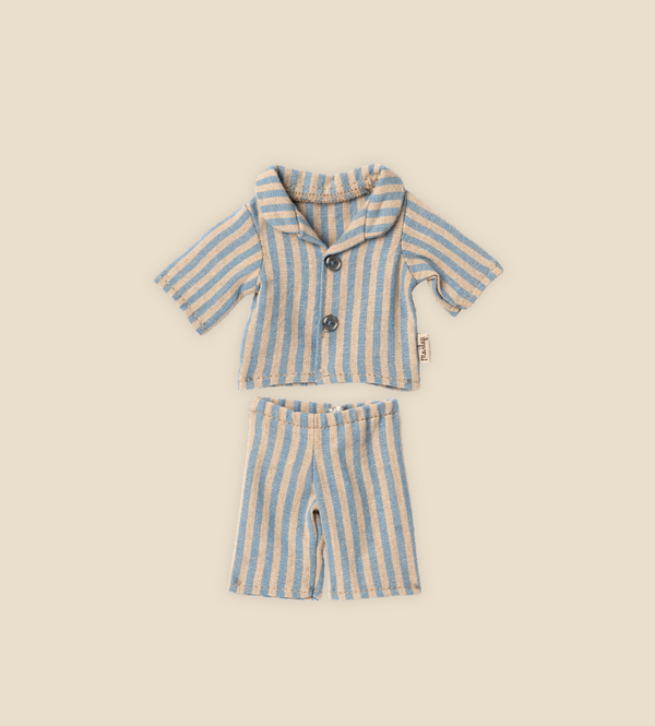 A neatly arranged striped pajama set designed for Teddy Junior, named "Maileg Extra Clothing: Pyjamas for Teddy Junior," consists of a button-up short-sleeved shirt and matching shorts. The outfit, which is available for purchase separately, features pastel blue and beige stripes on a beige background, perfect for a cozy night in with Teddy Junior.