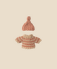 The Maileg Knitted Sweater and Hat for Big Sister Mouse, an ideal choice for wintertime attire, are showcased on a light beige background. The hat is pink, and the sweater displays horizontal pink and beige stripes. Both items are neatly centered.