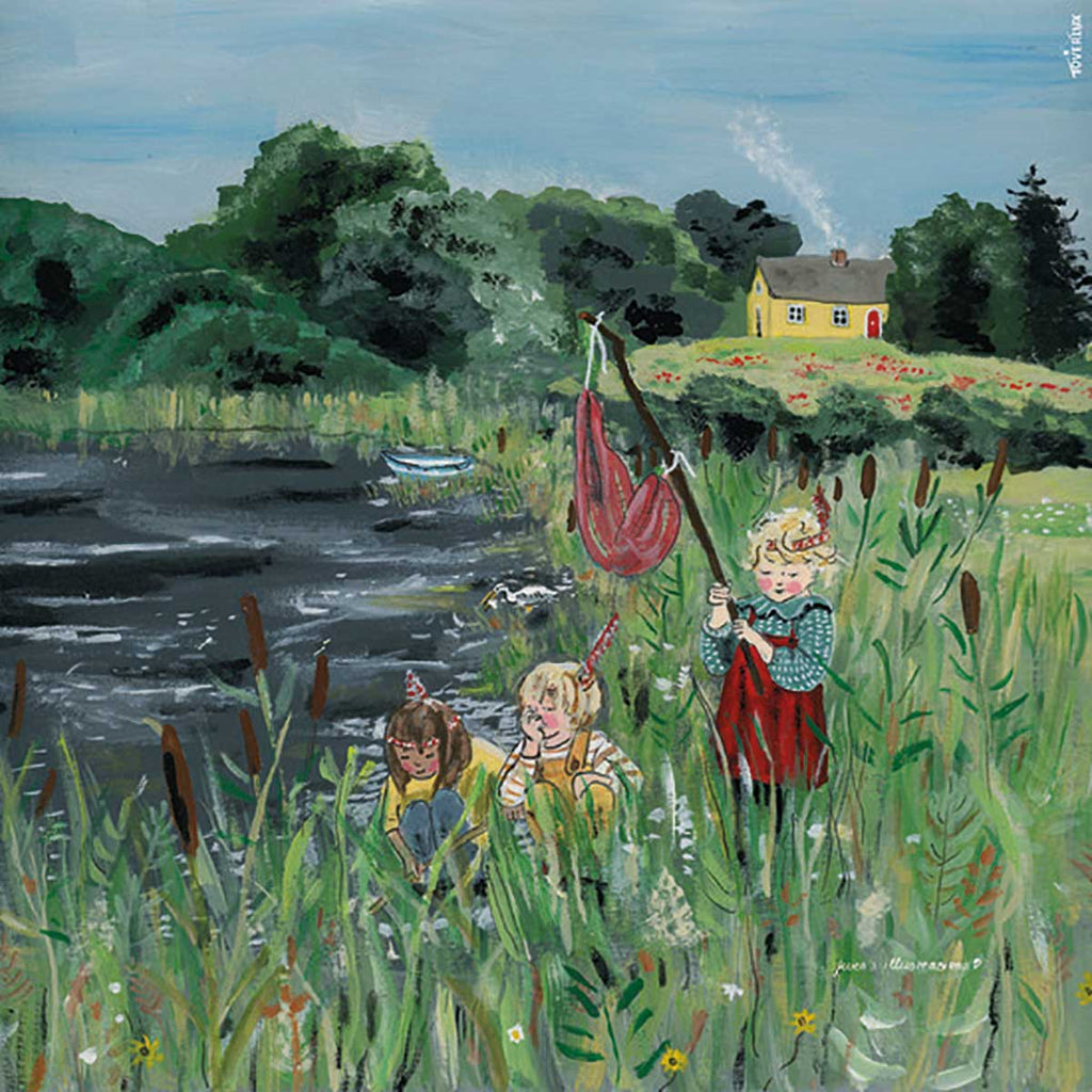 Illustration for the Silhouette Only - Waterfront Adventures for Toverlux Lamp features three children by a pond, surrounded by tall grass and cattails. One child holds a net made from translucent material, another leans on their hand, while the third kneels near the water. A small yellow house sits in the background amidst green trees under a blue sky. This product ships in approximately one week.