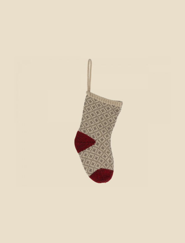 The Maileg Christmas Stocking in soft grey, featuring a subtle diamond pattern and perfect for holding small gifts, hangs by a loop against a plain light background.