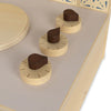 A close-up of three wooden knobs on a light-colored sustainable beech plywood Wooden Stove. The knobs have dark brown, flat, teardrop-shaped handles and are mounted on circular bases with markings indicating different settings.