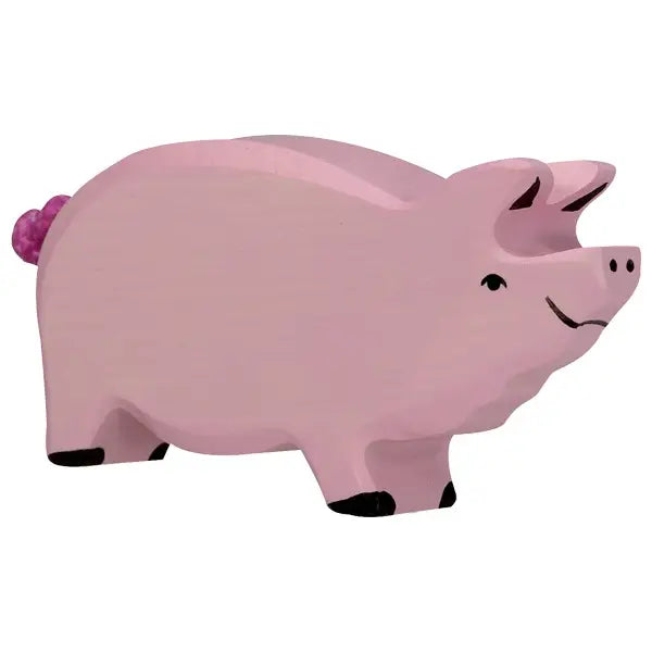 A handcrafted Holztiger Pig painted pink with black-tipped feet, featuring a happy expression and a curled tail. The pig has a simple, stylized design with minimal facial features. This charming piece is part of the renowned HOLZTIGER figures collection, Made in Europe.