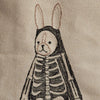 An embroidered image on fabric from the Coral & Tusk Halloween Costumes Bag depicts a costumed critter with a bunny head and human skeleton body. The bunny's head has pink inner ears, and the skeleton is detailed with black stitches against a light beige background, making it perfect for your Halloween ensemble.