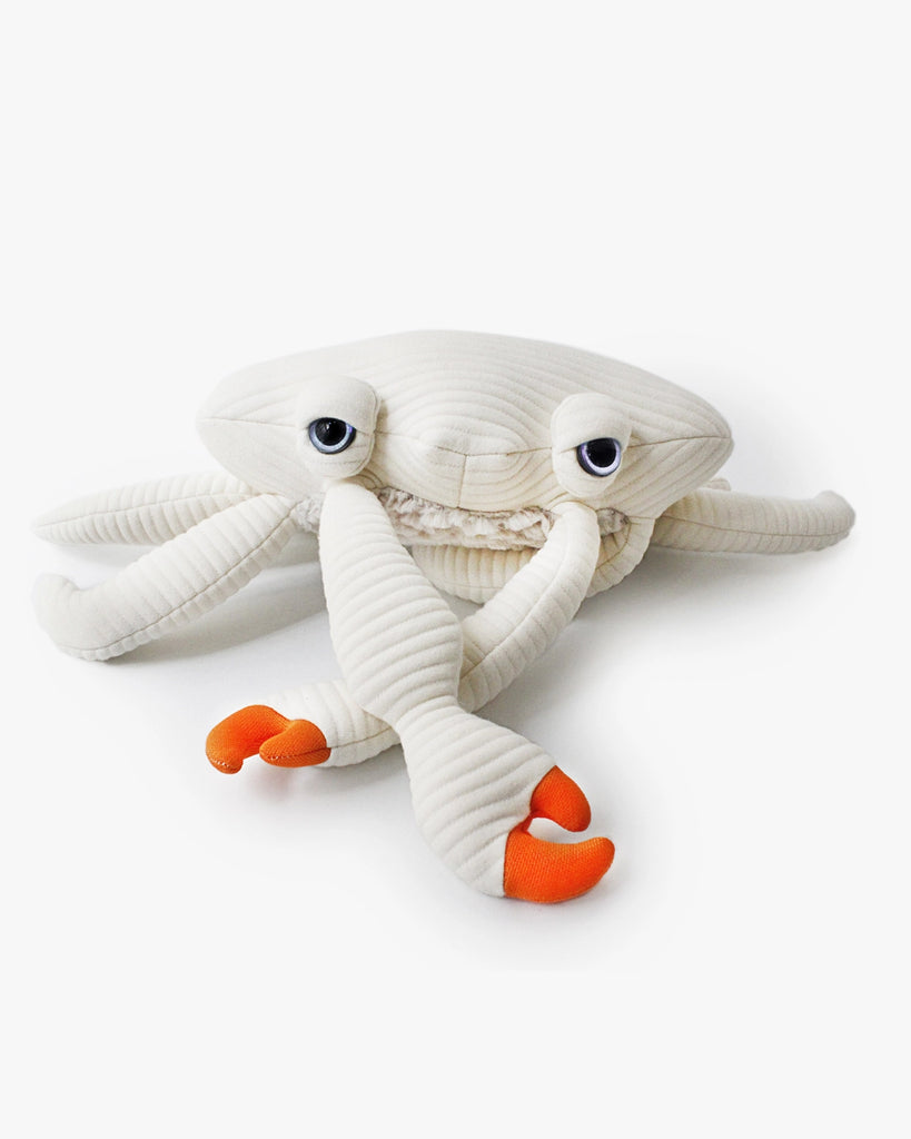 The BigStuffed Mini Crab - Sir plush toy features a soft, ribbed white body and orange-tipped pincers. This plush has large, expressive eyes and is perfect for newborns. The adorable toy is showcased against a plain white background.