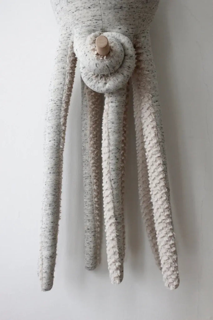 A close-up view of the BigStuffed Octopus - Big Original, showcasing its light grey, textured softness with long flowing tentacles and a spiraled feature near the top. The plain white background makes this charming stuffed octopus look ready to swim into your cherished underwater world. (Ships in approximately one week)