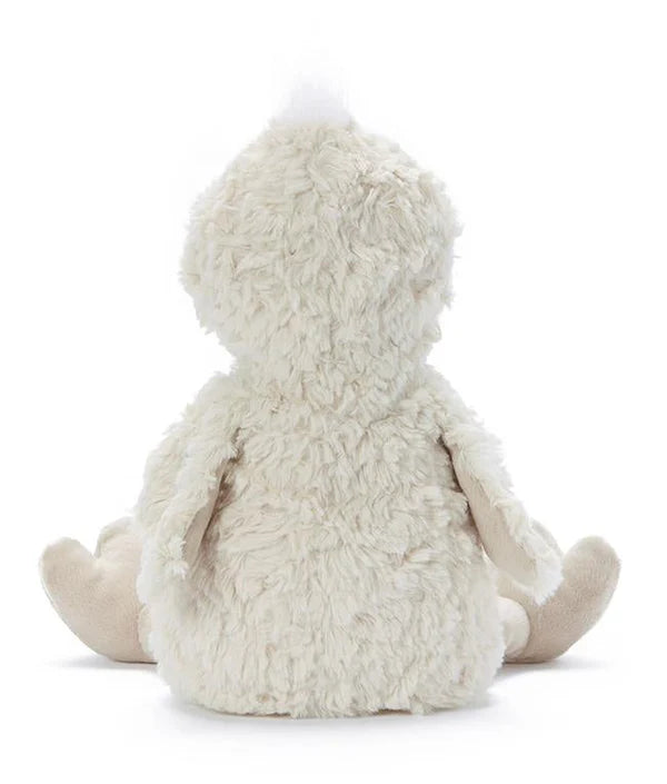 The Bill the Duck Stuffed Animal, with soft, cream-colored fur and floppy limbs, is depicted sitting with its back to the viewer. The cozy and plush toy contrasts against a plain white background.