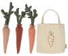 Three fabric carrots with different patterns (polka dots, gingham, and solid) next to a small beige tote bag with a carrot embroidery on the front. Perfect for imaginative play or for bunnies to enjoy, the Maileg Carrots In Bag have green fabric leaves and varying shades of orange.