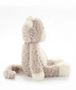 A fluffy, light brown and cream-colored stuffed monkey toy sits upright against a plain white background, facing sideways as if waiting for Checkers The Cat Stuffed Animal or daydreaming about peaceful farm life. Its tail is curled beside it.