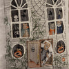 The Haunted House Pocket Pillow features an embroidered scene on fabric depicting a spooky, haunted house. The windows reveal skeletons, animals in costumes, a witch, and a wizard. The door shows an animal in a mummy costume stepping out. Jack-o'-lanterns with carved faces and ivy enhance the Halloween theme.