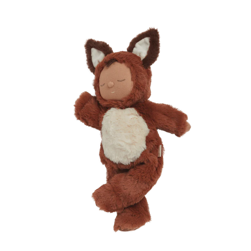 Introducing the Olli Ella Cozy Dinkum Doll - Fox, a charming plush toy from the Cozy Dinkums collection. This cute creation resembles a slumbering infant dressed in an adorable brown and white fox outfit, featuring closed eyes and floppy limbs. It's ideal for cuddles and imaginative playtime adventures.